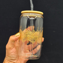Load image into Gallery viewer, Hand painted glass tumbler with lid and straw- intricate henna inspired art in Gold.