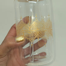Load image into Gallery viewer, Hand painted glass tumbler with lid and straw- intricate henna inspired art in Gold.