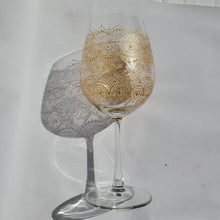 Load image into Gallery viewer, Hand Painted Wine Glass with intricate Gold Bohemian Henna Designs. Elegant and stunning