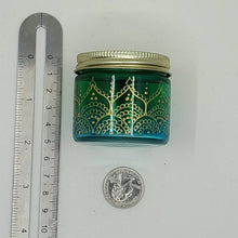 Load image into Gallery viewer, Hand Stained-Painted glass jar - green fading to blue (ombre) with intricate gold (henna style) designs.