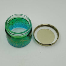 Load image into Gallery viewer, Hand Stained-Painted glass jar - green fading to blue (ombre) with intricate gold (henna style) designs.