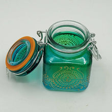 Load image into Gallery viewer, Hand Stained-Painted glass jar - blue fading to green (ombre) with intricate gold (henna style) designs.

