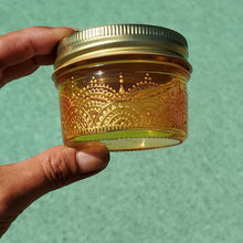 Load image into Gallery viewer, Hand Stained - Hand Painted wide mouth glass jar - yellow fading to orange (ombre) with intricate gold (henna style) designs. Boho