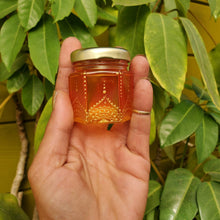 Load image into Gallery viewer, Hand Stained-Painted glass jar- orange fading to yellow with intricate gold henna style designs in gold