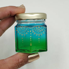 Load image into Gallery viewer, Hand Stained-Painted glass jar- green fading to blue with intricate gold henna style designs in gold