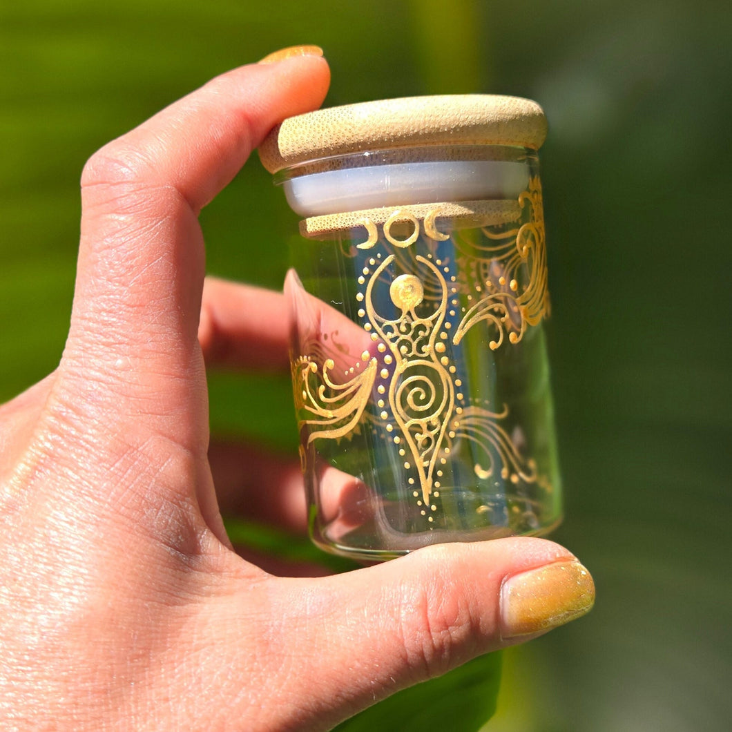 Stash Jar. Hand painted glass jar with sacred Goddess and moon cycles painted in gold. Airtight, straight sided, portable herb jar