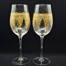 Load image into Gallery viewer, Hand Painted crystal wine glassess - intricate henna inspired art in Gold.