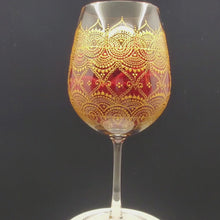 Load and play video in Gallery viewer, Hand Painted Wine Glass with intricate Gold Bohemian Henna Designs. Elegant and stunning
