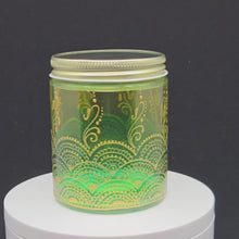 Load and play video in Gallery viewer, Hand Stained - Hand Painted glass jar - green fading to yellow (ombre) with intricate gold (henna style) designs.
