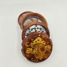 Load image into Gallery viewer, Medium size 4 part Herb Grinder with Kief catcher. Hand painted mushrooms on imitation wood. Sharp teeth, magnetic closure with smooth grinding
