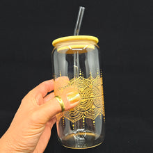 Load image into Gallery viewer, Hand painted glass tumbler with lid and straw- intricate henna inspired art in Gold.
