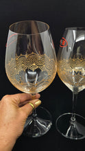 Load image into Gallery viewer, Hand Painted Riedel crystal wine glasses - intricate henna inspired art in Gold.

