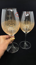 Load image into Gallery viewer, Hand Painted Riedel crystal wine glasses - intricate henna inspired art in Gold.
