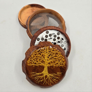 Medium size 4 part Herb Grinder with pollen catcher. Hand painted tree of life on imitation wood. Sharp teeth, magnetic closure with smooth grinding