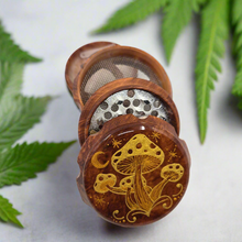 Load image into Gallery viewer, Medium size 4 part Herb Grinder with Kief catcher. Hand painted mushrooms on imitation wood. Sharp teeth, magnetic closure with smooth grinding
