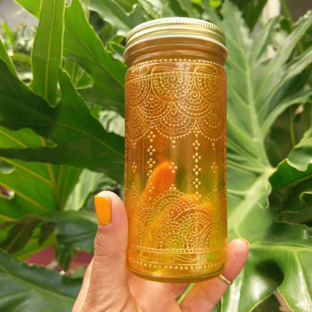 Hand Stained-Painted glass jar- orange fading to yellow (Ombre) with intricate gold 'henna style' designs. Bohemian centerpiece.