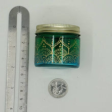 Load image into Gallery viewer, Hand Stained-Painted glass jar - green fading to blue (ombre) with intricate gold (henna style) designs.
