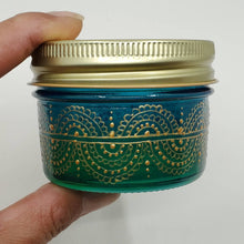 Load image into Gallery viewer, Hand Stained - Hand Painted wide mouth glass jar - blue fading to green (ombre) with intricate gold (henna style) designs. Boho
