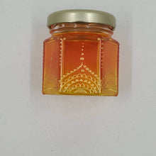 Load image into Gallery viewer, Hand Stained-Painted glass jar- orange fading to yellow with intricate gold henna style designs in gold
