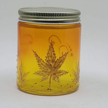 Load image into Gallery viewer, Hand Stained - Hand Painted glass nug jar - orange fading to yellow (Ombre) with gold marijuana leaves and swirls . Boho
