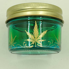 Load image into Gallery viewer, Hand Stained - Hand Painted glass nug jar - Wide Mouth! Green fading to blue (Ombre) with gold marijuana leaves and swirls . Boho
