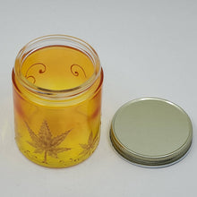 Load image into Gallery viewer, Hand Stained - Hand Painted glass nug jar - orange fading to yellow (Ombre) with gold marijuana leaves and swirls . Boho
