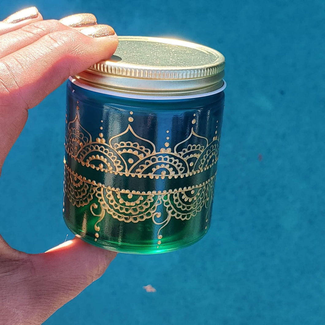 Hand Stained-Painted glass jar- green fading to blue(hombre) with intricate gold (henna style) designs.