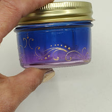 Load image into Gallery viewer, Hand Stained - Hand Painted glass nug jar - Wide Mouth! Purple fading to blue (Ombre) with gold marijuana leaves and swirls . Boho
