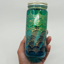 Load image into Gallery viewer, Hand Stained-Painted glass jar- green fading to blue(ombre) with intricate gold henna style designs
