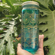 Load image into Gallery viewer, Hand Stained-Painted glass jar- green fading to blue(ombre) with intricate gold henna style designs
