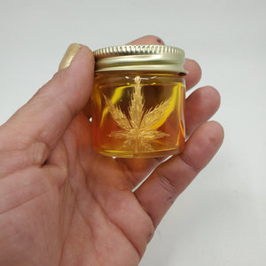 Hand Stained-Painted glass stash jar - orange fading to yellow (ombre) with weed leaf painted in gold