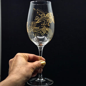 Hand Painted Crystal wine glass. Intricate gold henna inspired art winding around the entire glass.