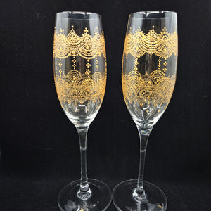 Hand Painted crystal champagne glass/ flute- intricate henna inspired art in Gold wrapping all around the glass.