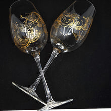 Load image into Gallery viewer, Hand Painted Crystal wine glass. Intricate gold henna inspired art winding around the entire glass.

