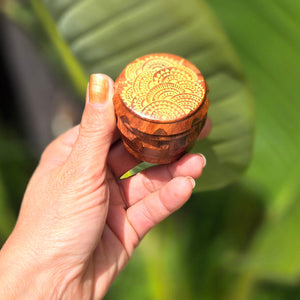 Small 4 part Herb Grinder with Kief catcher. Hand painted henna designs on imitation wood. Sharp teeth, magnetic closure with smooth grinding