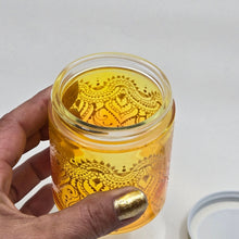 Load image into Gallery viewer, Hand Stained - Hand Painted glass jar - orange fading to yellow (ombre) with intricate gold (henna style) designs.
