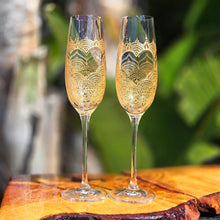 Load image into Gallery viewer, Wedding glasses for the bride with customized names, hand painted in a heart with gold on a champagne flute. Personalized toasting glasses.
