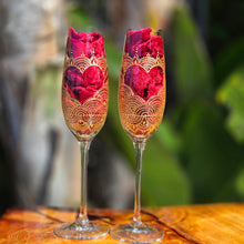 Load image into Gallery viewer, Wedding glasses for the bride with customized names, hand painted in a heart with gold on a champagne flute. Personalized toasting glasses.
