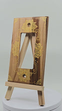 Load and play video in Gallery viewer, Hand Painted Cherry wood Switch / Cover / Wall plate for Paddle switch or decora outlet -Midsized. Gold henna inspired designs on solid wood
