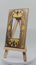 Load and play video in Gallery viewer, Hand Painted Walnut wood Switch / Cover / Wall plate for Paddle switch or decora outlet -Midsized. Gold henna inspired designs with lotus on solid wood
