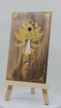 Load and play video in Gallery viewer, Hand Painted Walnut wood Switch / Cover / Wall plate for Toggle switch - Midsized. Gold lotus with henna inspired designs on solid wood
