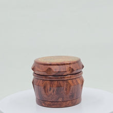 Load and play video in Gallery viewer, Small 4 part Herb Grinder with Kief catcher. Hand painted henna designs on imitation wood. Sharp teeth, magnetic closure with smooth grinding
