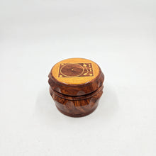 Load image into Gallery viewer, Medium size 4 part Herb Grinder with Kief catcher. Hand painted Turntable on imitation wood. Sharp teeth, magnetic closure with smooth grinding
