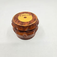 Load image into Gallery viewer, Medium size 4 part Herb Grinder with Kief catcher. Hand painted Studio 1 logo on imitation wood. Sharp teeth, magnetic closure with smooth grinding
