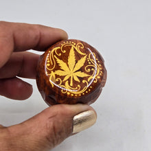 Load image into Gallery viewer, Mini/ tiny 4 part Herb Grinder with Kief catcher. Hand painted weed leaf on imitation wood. Sharp teeth, magnetic closure with smooth grinding
