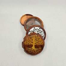 Load image into Gallery viewer, Medium size 4 part Herb Grinder with Kief catcher. Hand painted tree of life on imitation wood. Sharp teeth, magnetic closure with smooth grinding
