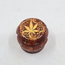 Load image into Gallery viewer, Mini/ tiny 4 part Herb Grinder with Kief catcher. Hand painted weed leaf on imitation wood. Sharp teeth, magnetic closure with smooth grinding
