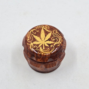 Mini/ tiny 4 part Herb Grinder with Kief catcher. Hand painted weed leaf on imitation wood. Sharp teeth, magnetic closure with smooth grinding