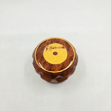 Load image into Gallery viewer, Medium size 4 part Herb Grinder with Kief catcher. Hand painted Studio 1 logo on imitation wood. Sharp teeth, magnetic closure with smooth grinding
