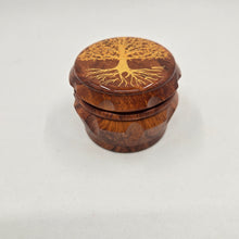 Load image into Gallery viewer, Medium size 4 part Herb Grinder with Kief catcher. Hand painted tree of life on imitation wood. Sharp teeth, magnetic closure with smooth grinding
